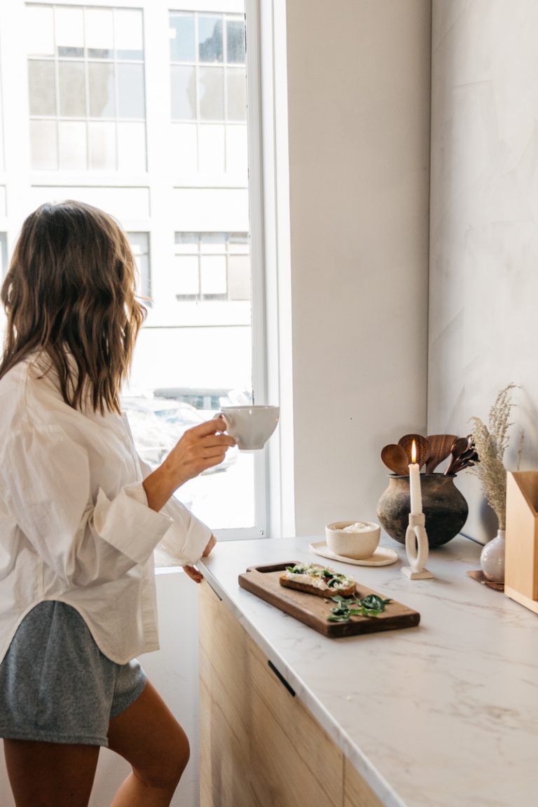 Woman drinking tea Best tea for sore throat