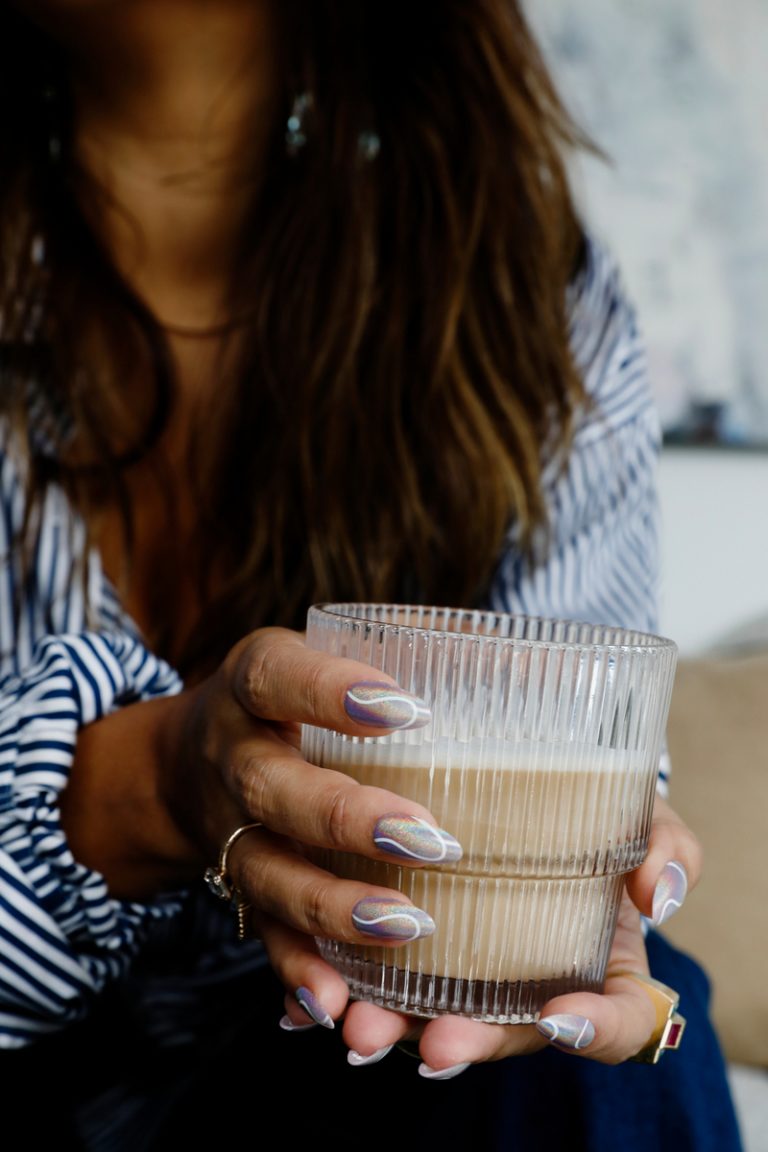 woman holding iced latte nude nail colors