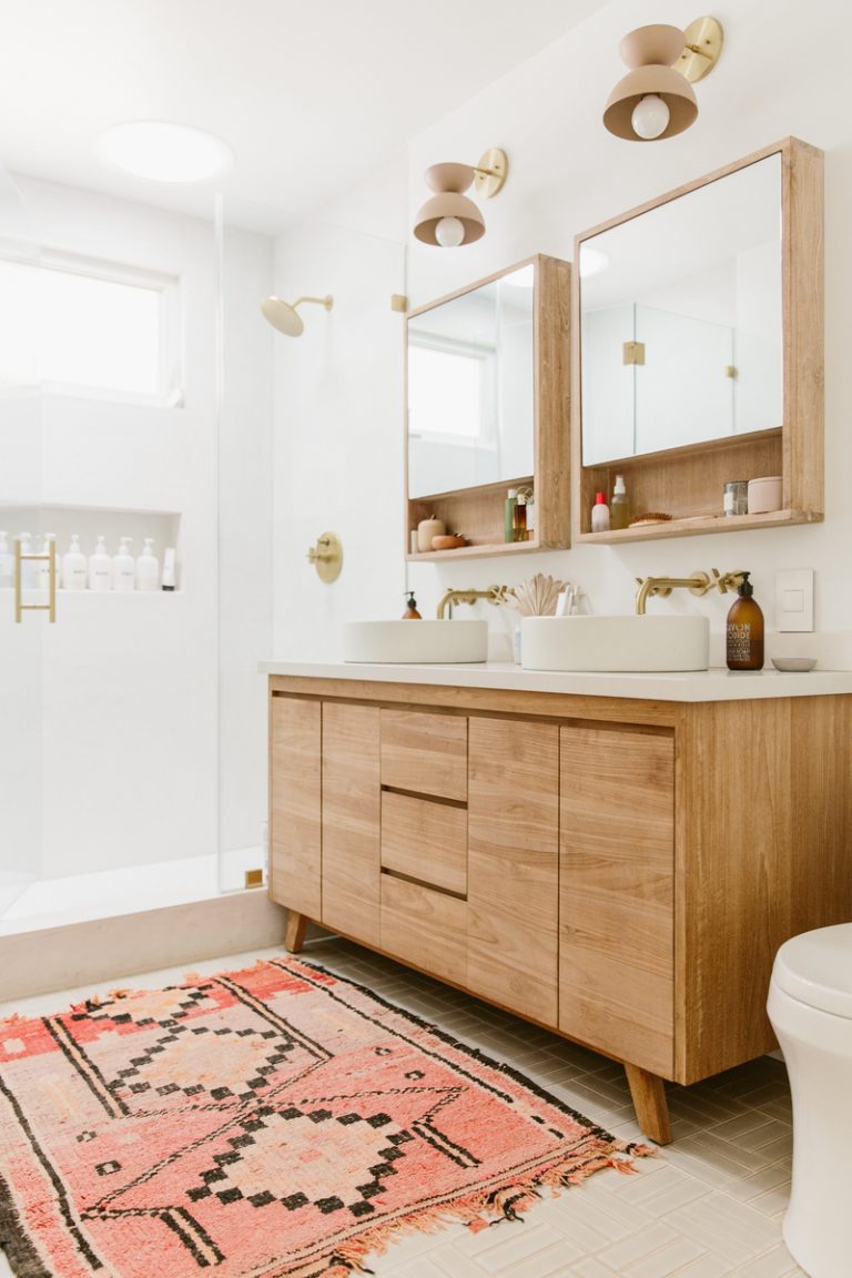 clean light bathroom with his and hers sinks