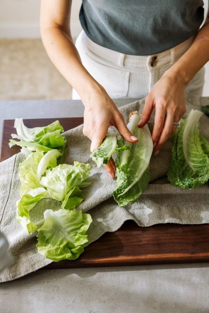 washing lettuce, fresh spring produce, greens, meal prep, kitchen, casa zuma gathering board