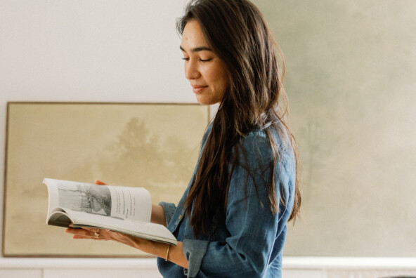how to be creative - woman reading book in studio