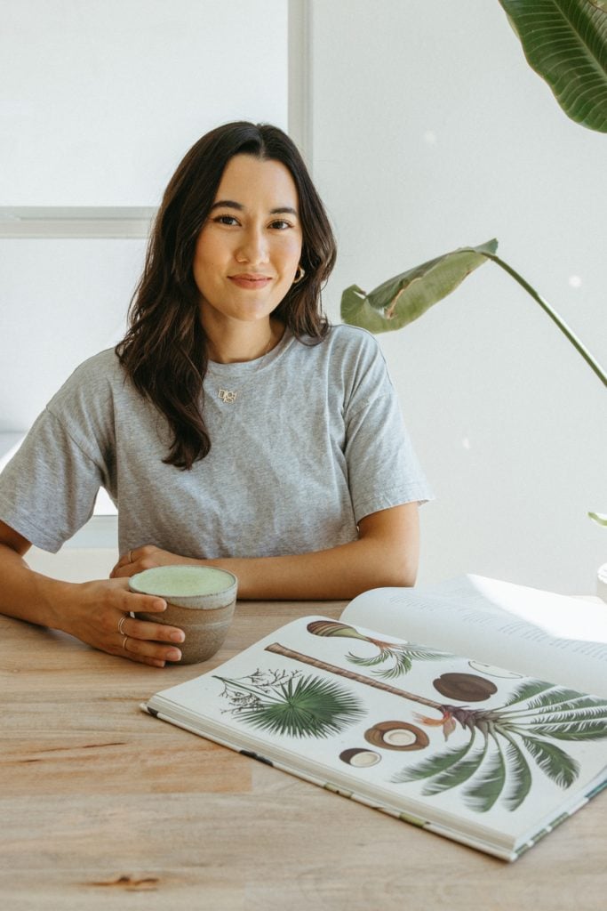 woman drinking matcha reading