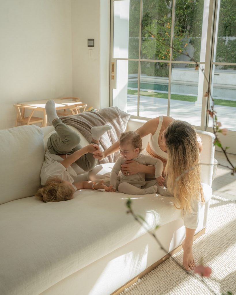 woman playing with family 