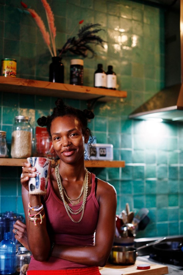 woman drinking out of artistic ceramic cup alcohol and gut health