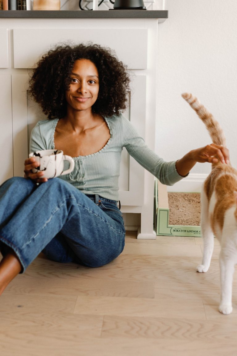 woman stroking cat alcohol and gut health