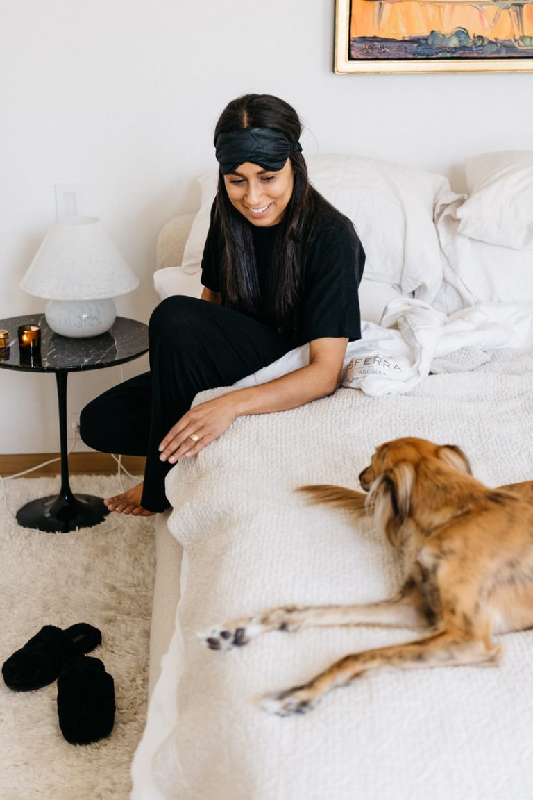 woman with dog in bed