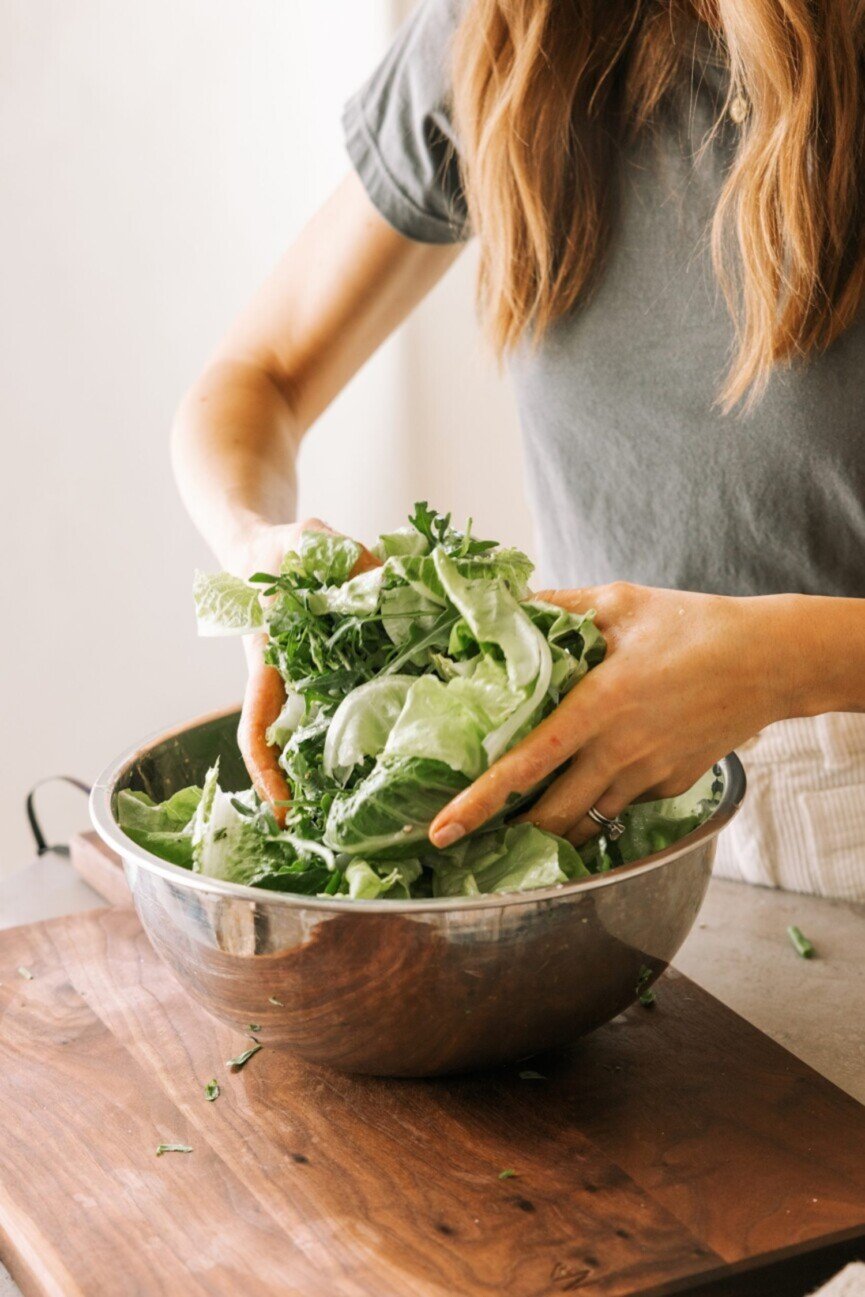 Tossing best simple green salad.