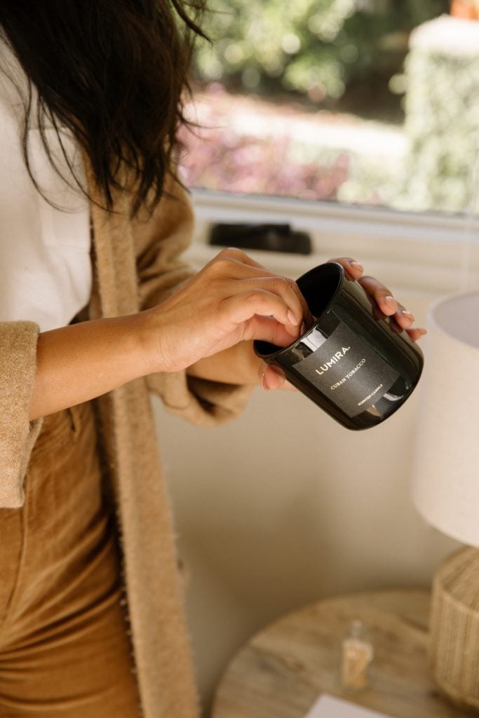 woman lighting candle