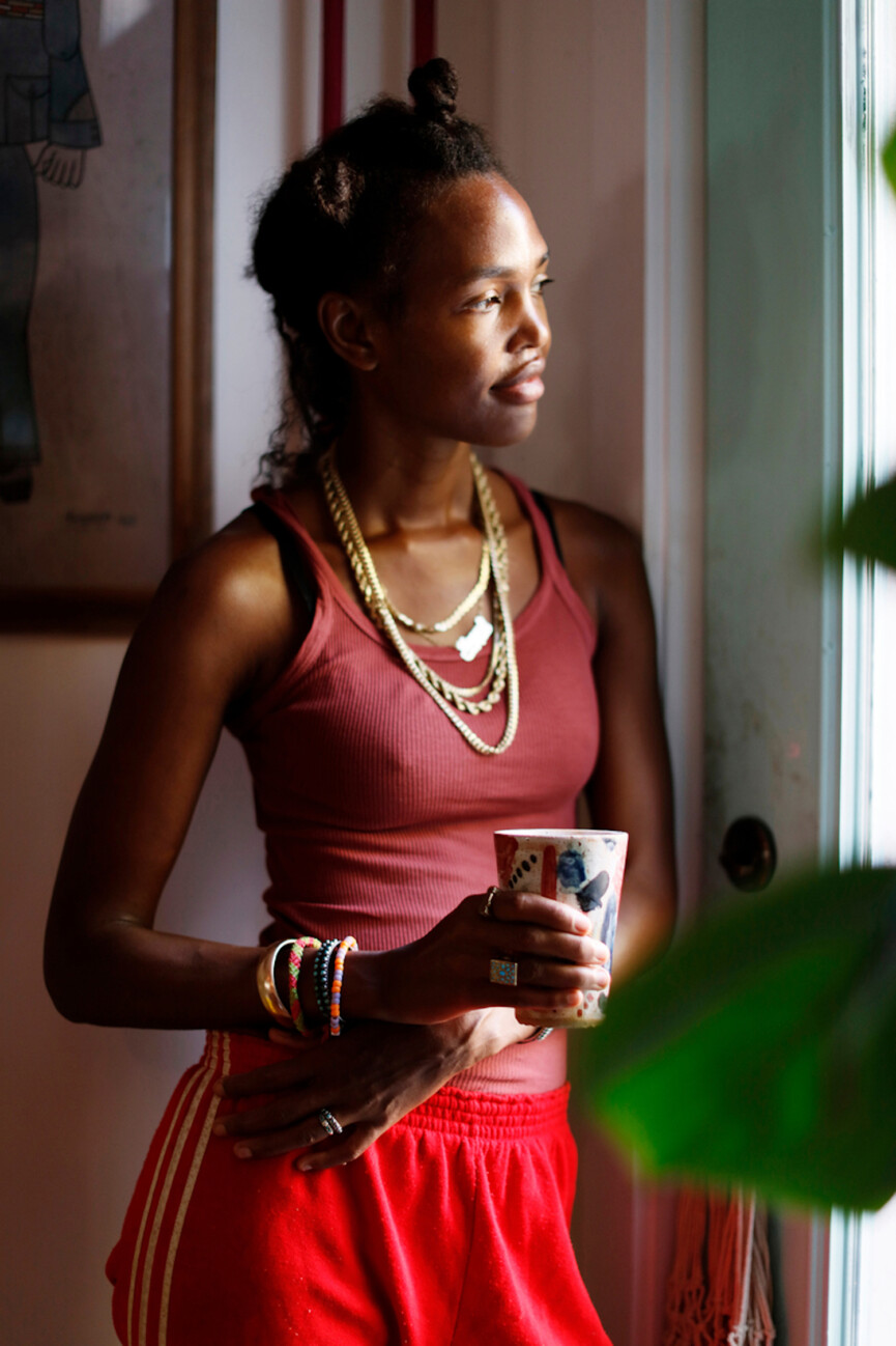 Woman looking out window.