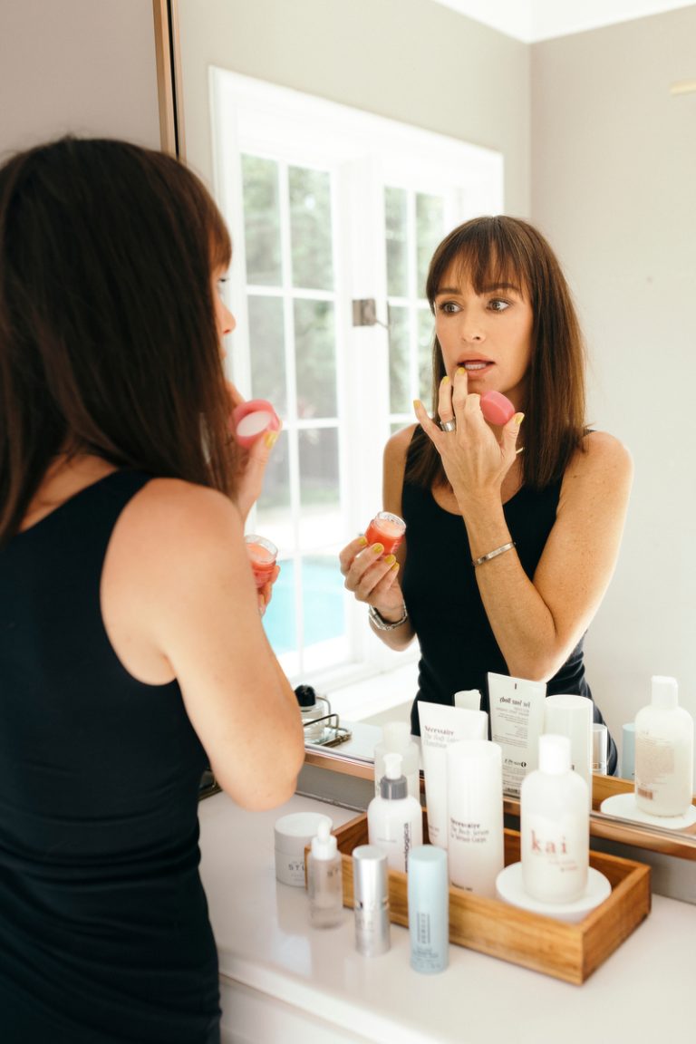 catt sadler applying lip balm