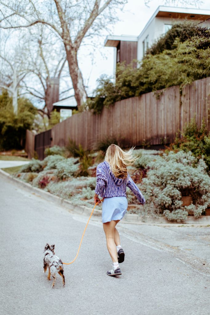 woman walking dog, primal movement