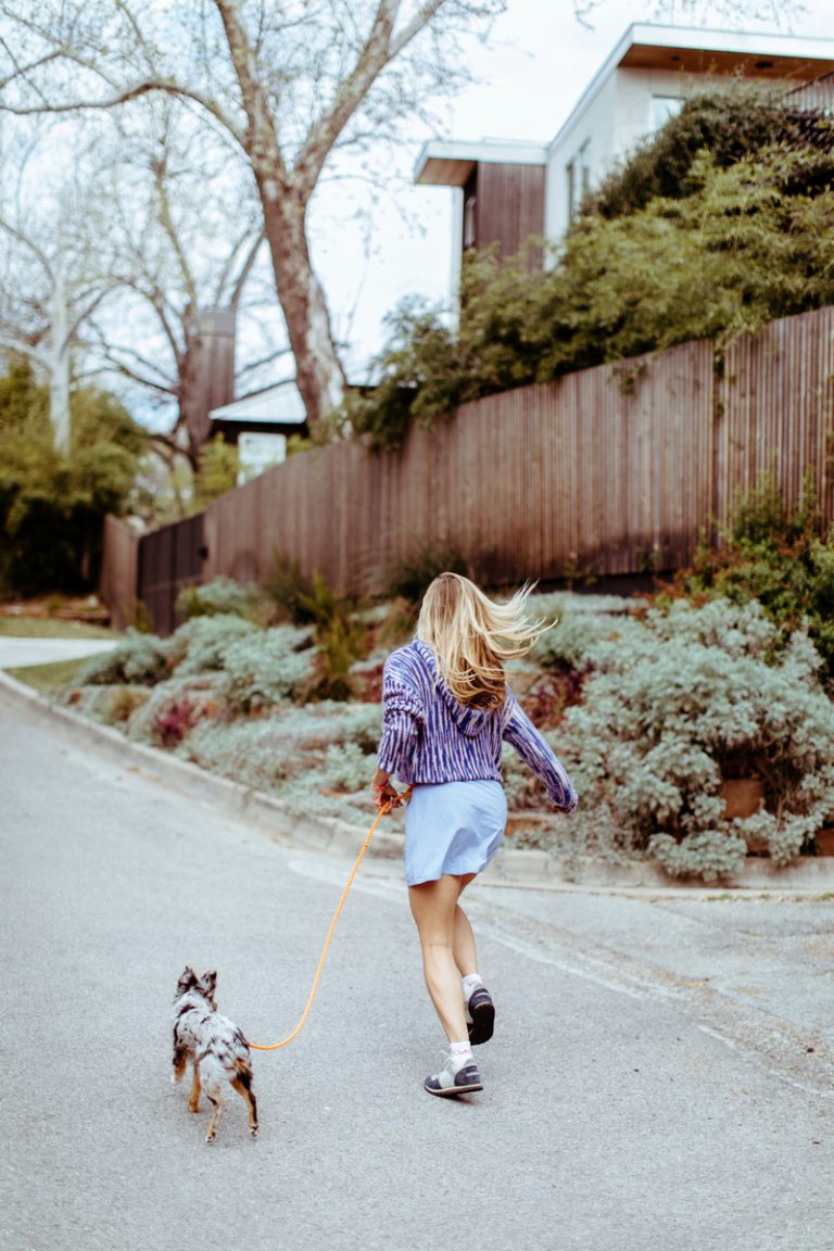 Woman walking the dog, primitive exercise