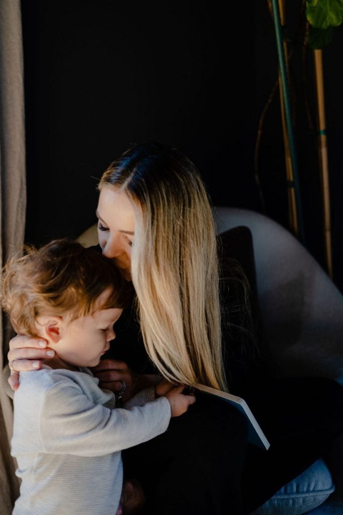 mother and son embrace, when should kids get phones