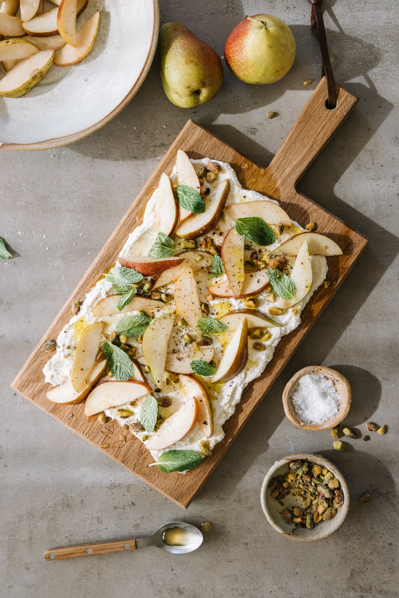 ricotta board recipe with pears and pistachios on casa zuma gathering board, fruit, winter appetizer