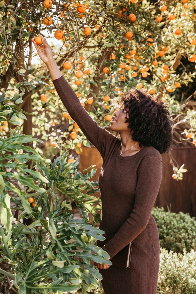 woman picking fruit, how to set boundaries