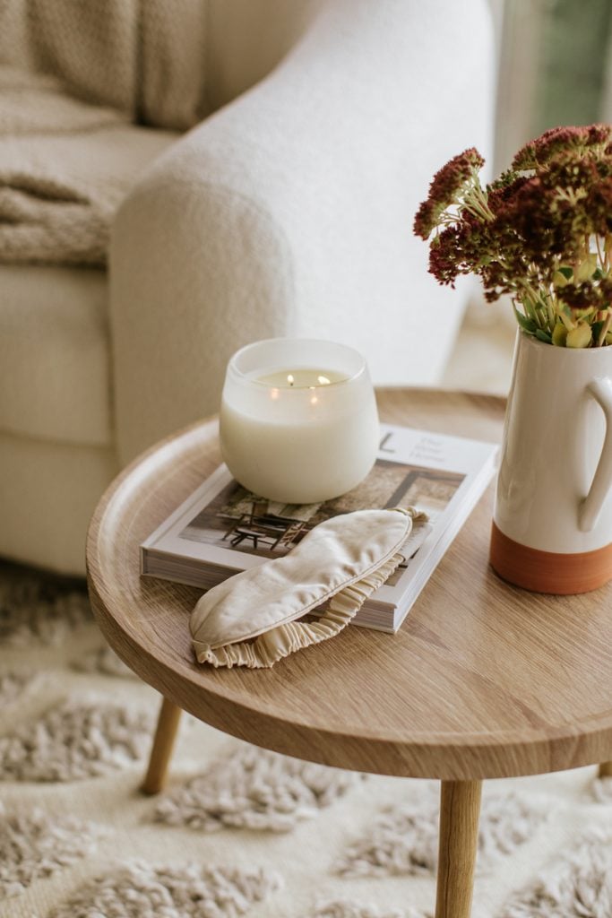 side table with candle, best self help books