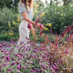 A woman walking through a garden