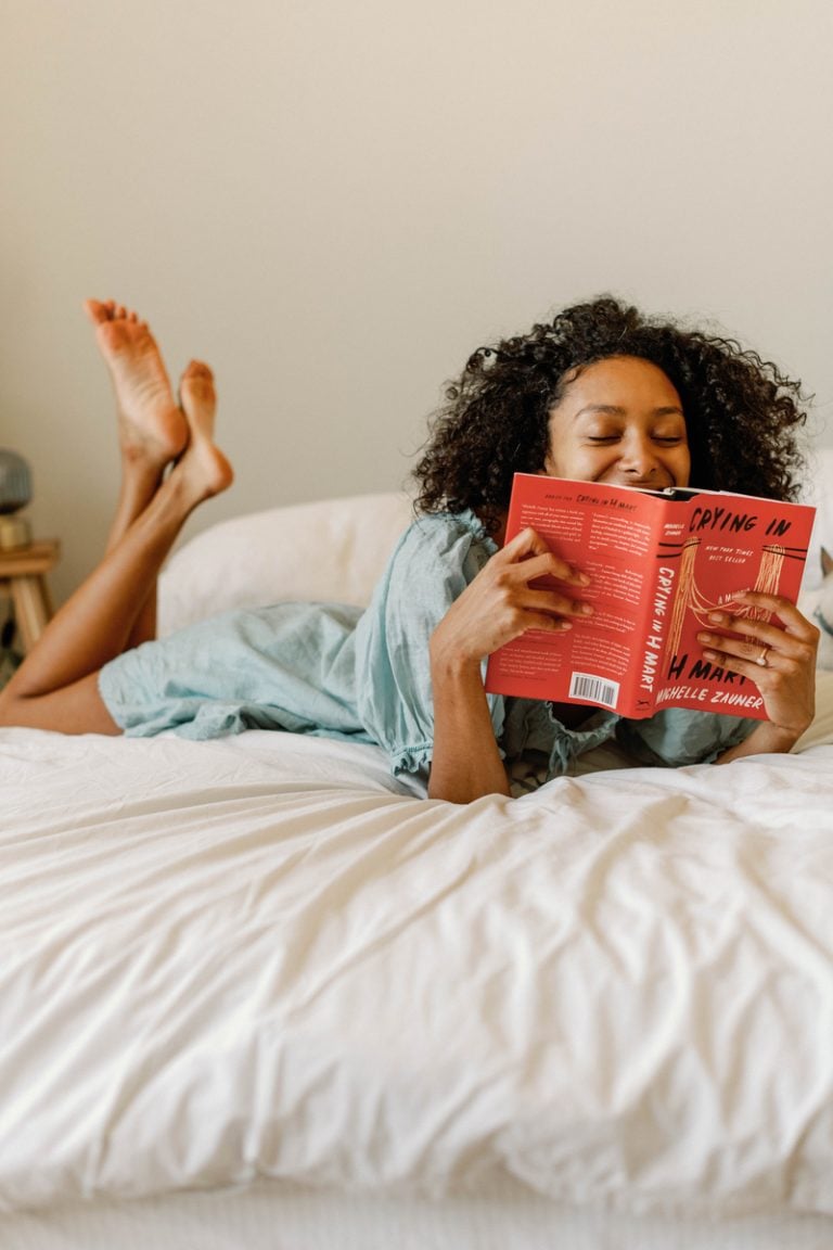 woman reading in bed, online dating advice