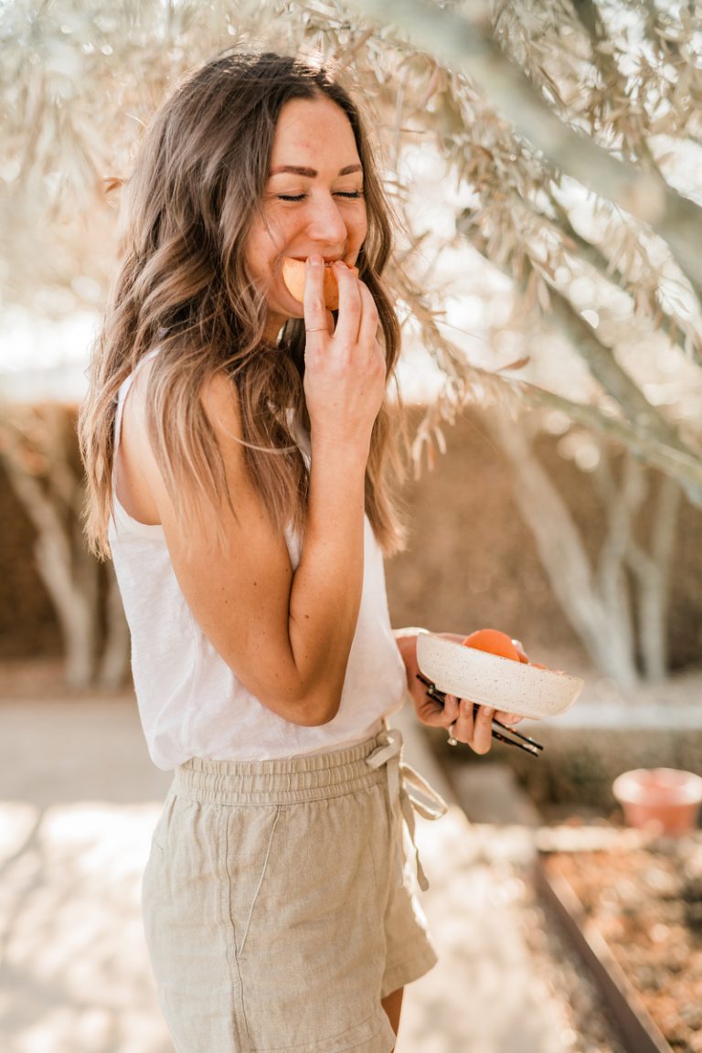 woman eating fruit, spring clean your life