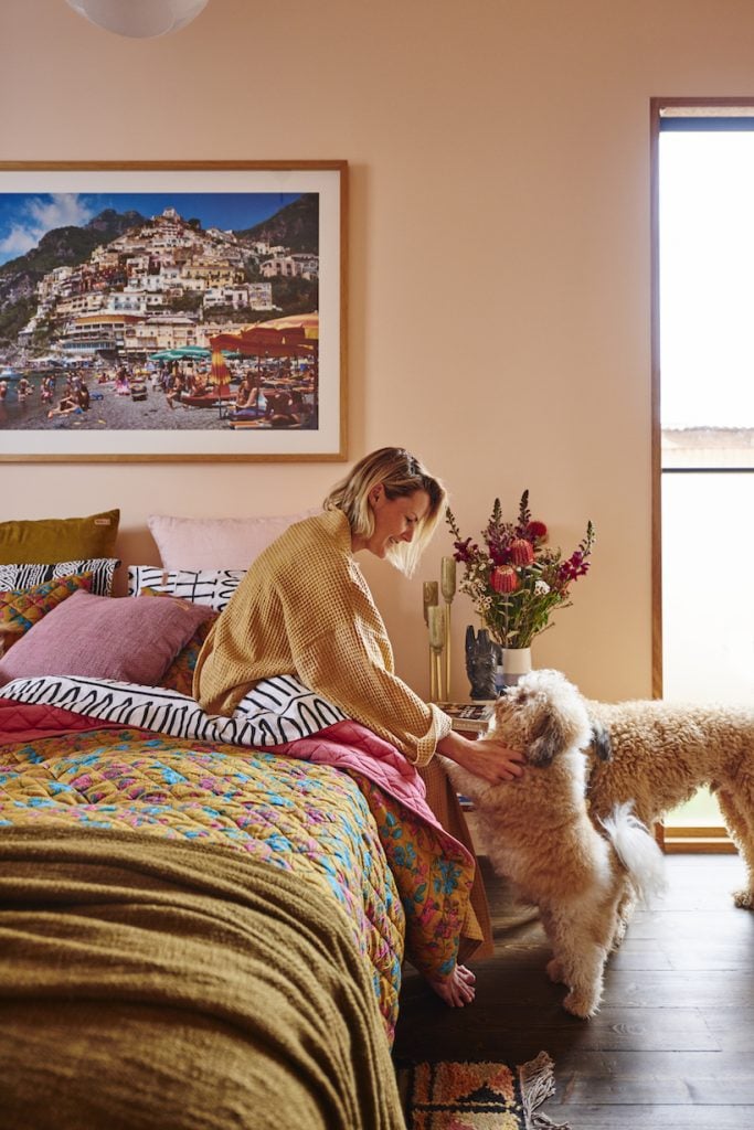 woman petting dog, mother's day gifts