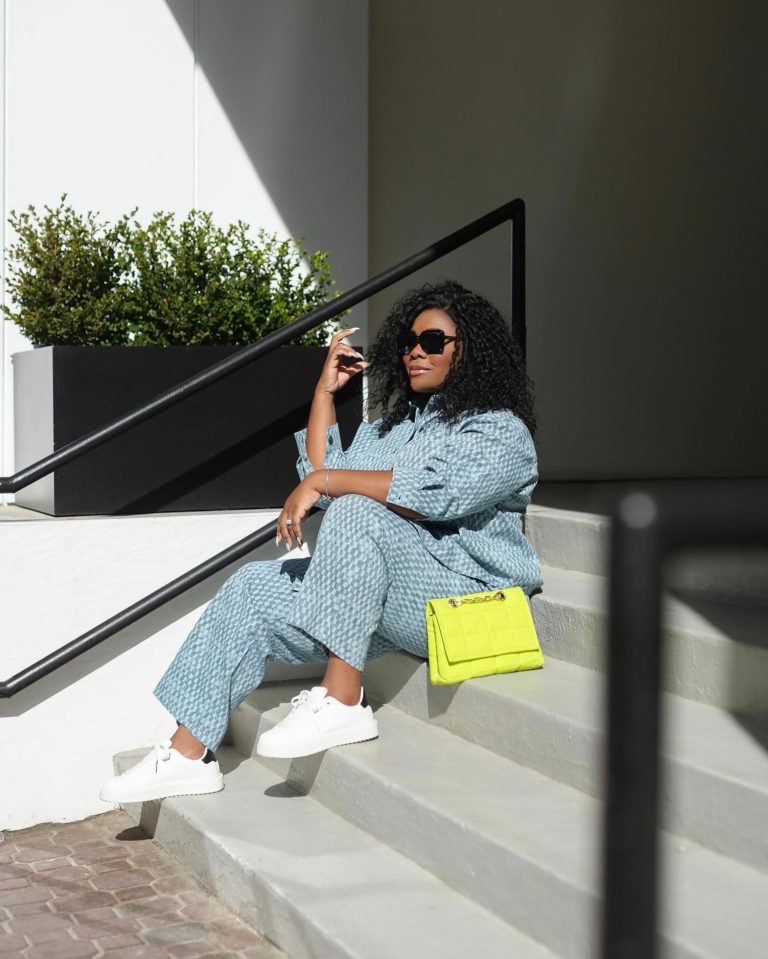 woman in blue denim set with lime green bag