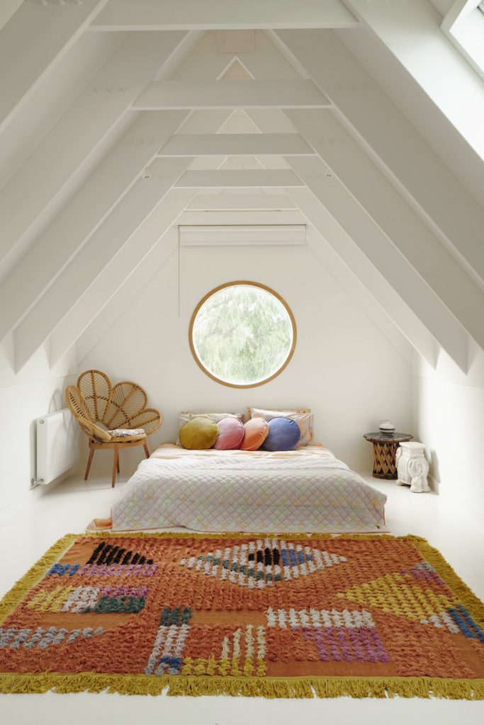 bedroom with colored area rug