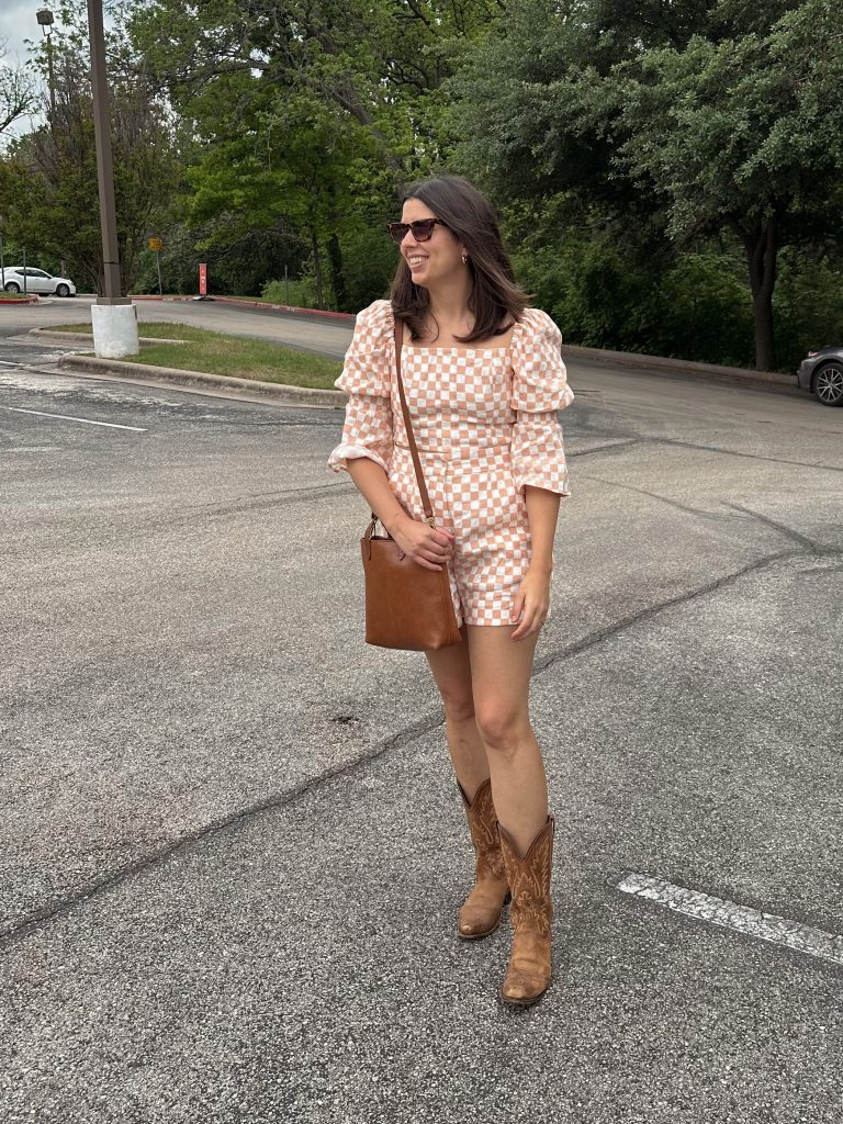 brunch outfit idea: woman in matching gingham set with cowboy boots