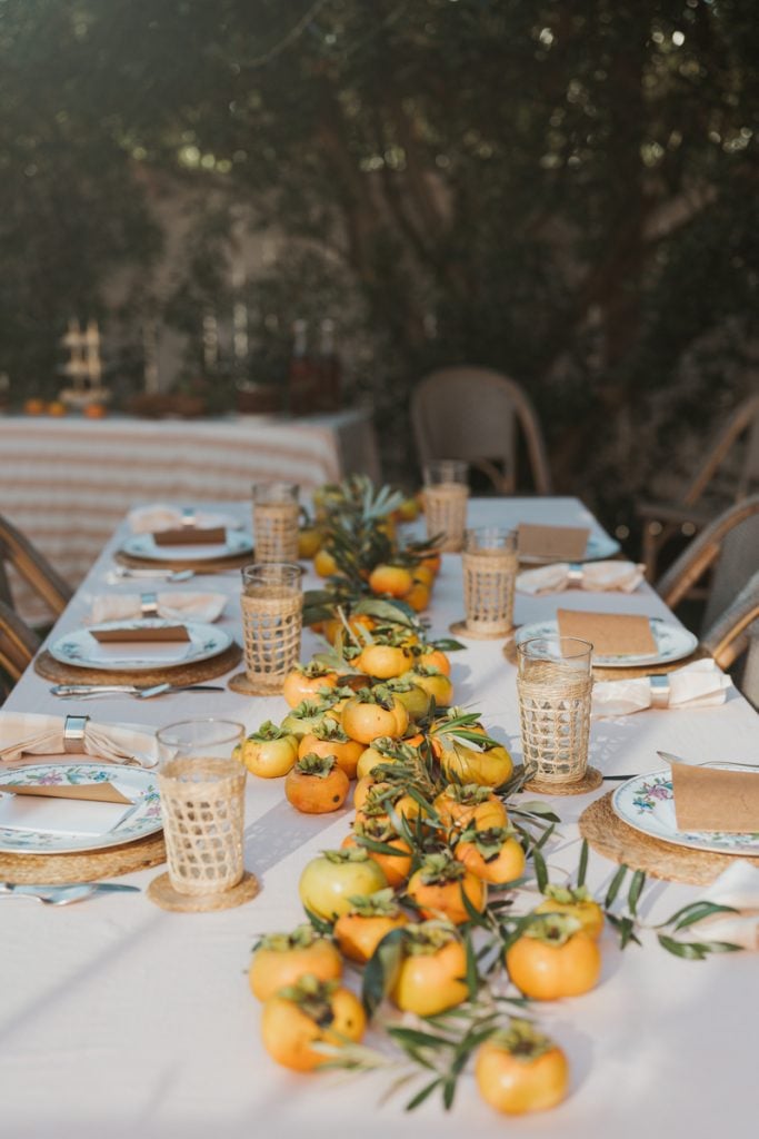 A table covered with persimmons as a centerpiece for brunch