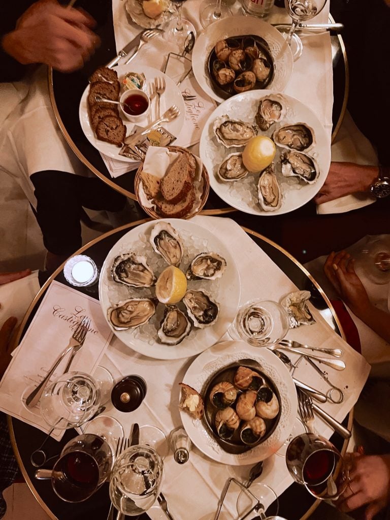 Oysters, escargot, and wine at Clown Bar in Paris.