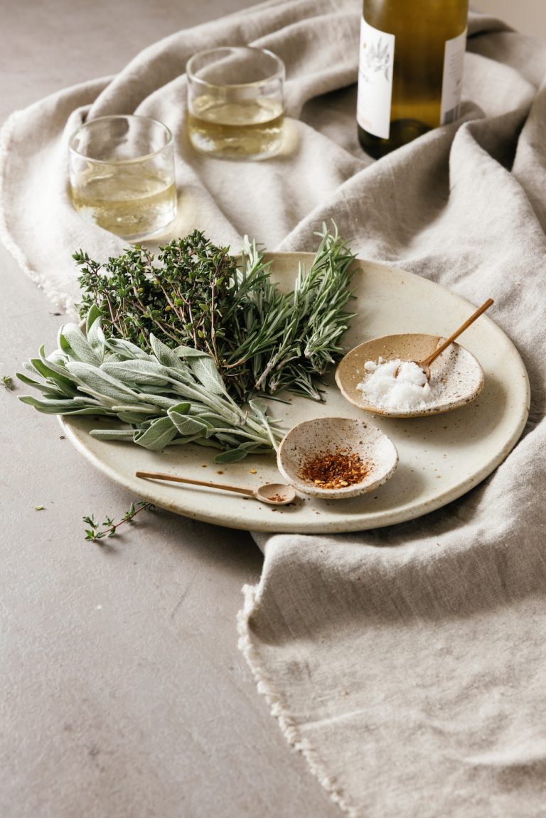 natural linen tablecloth, casa zuma table throw, salt, herbs, stemless wine glasses