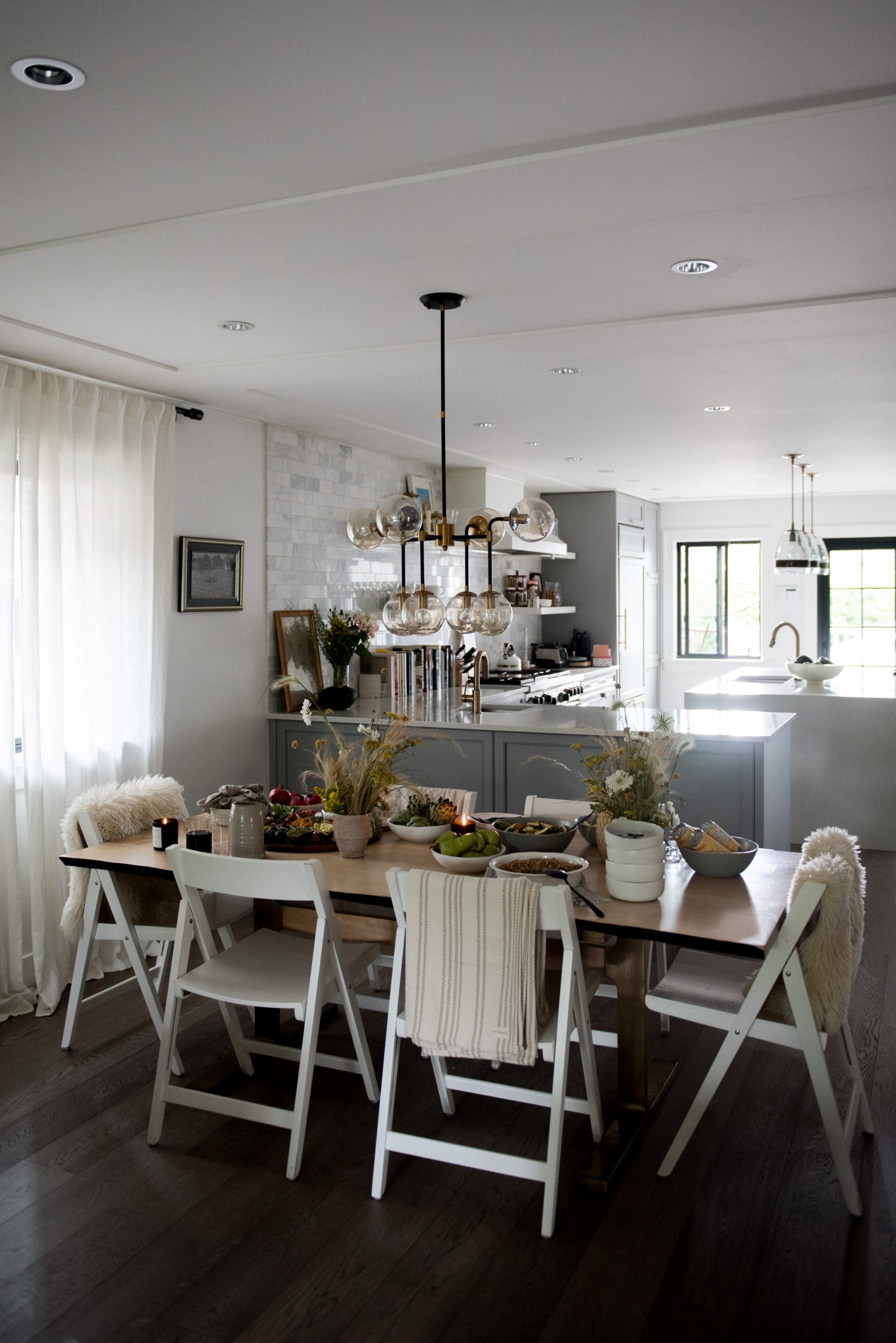 blankets over chairs for a small dinner party