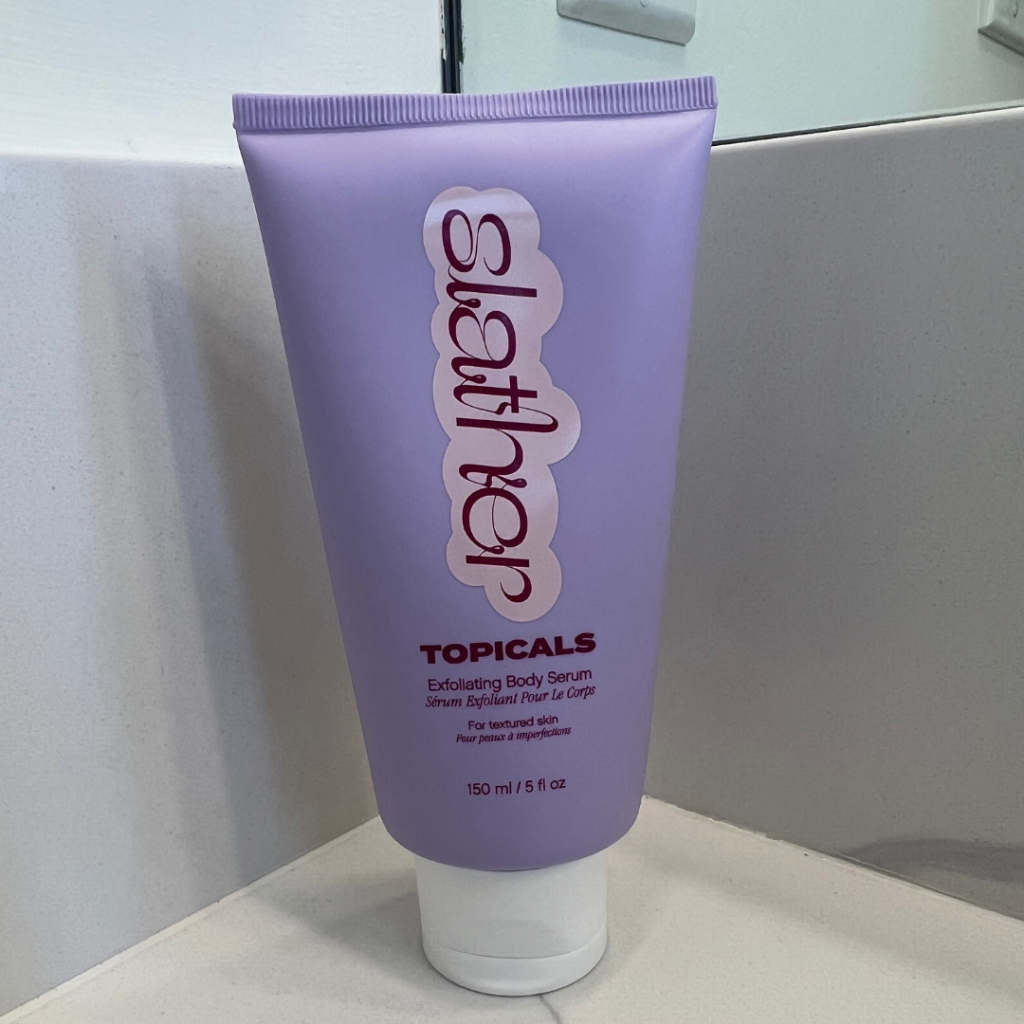 Purple bottle of Topicals Slather Exfoliating Body Serum