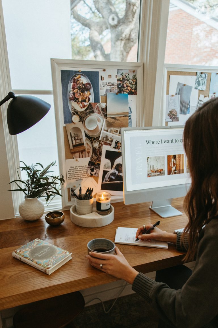 woman writing at desk