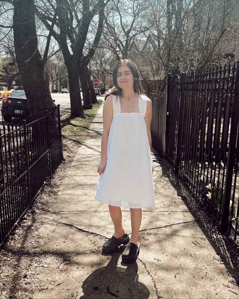  woman in white eyelet dress by everlane