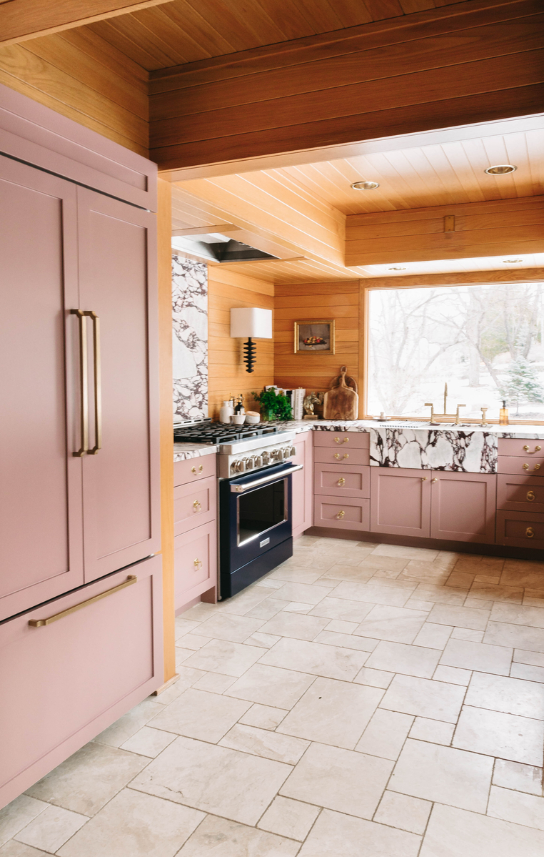 Mid-century modern kitchen with pink cabinets.