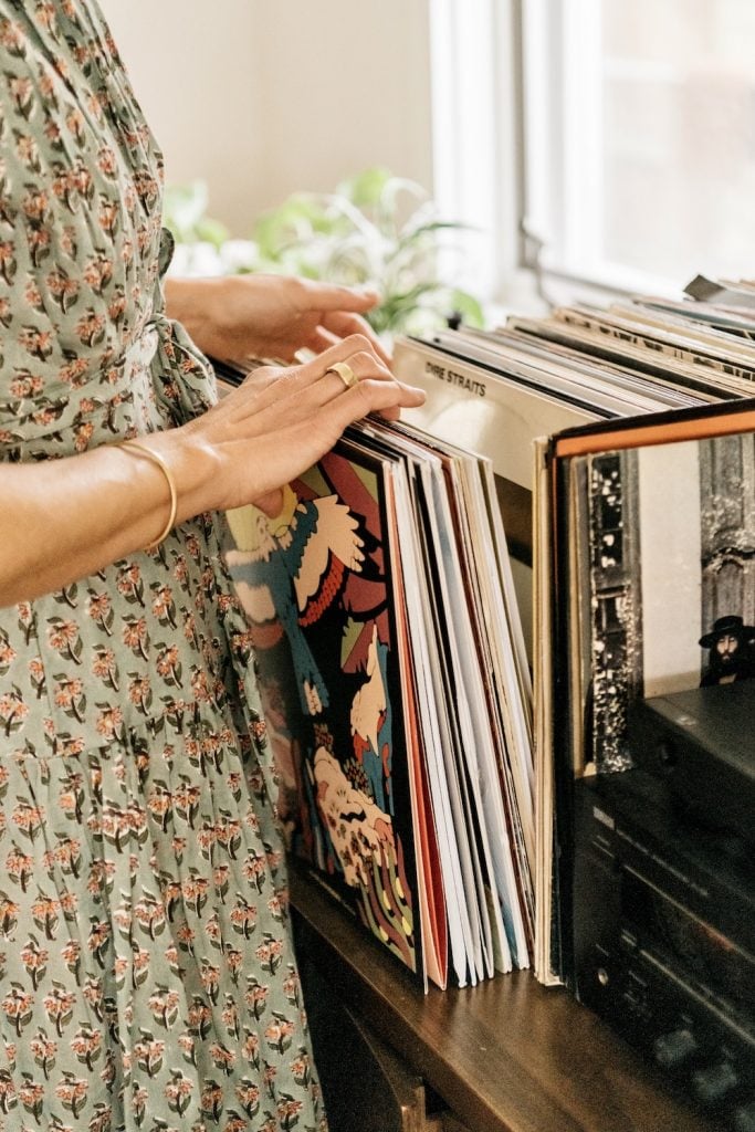 Woman flipping through records.