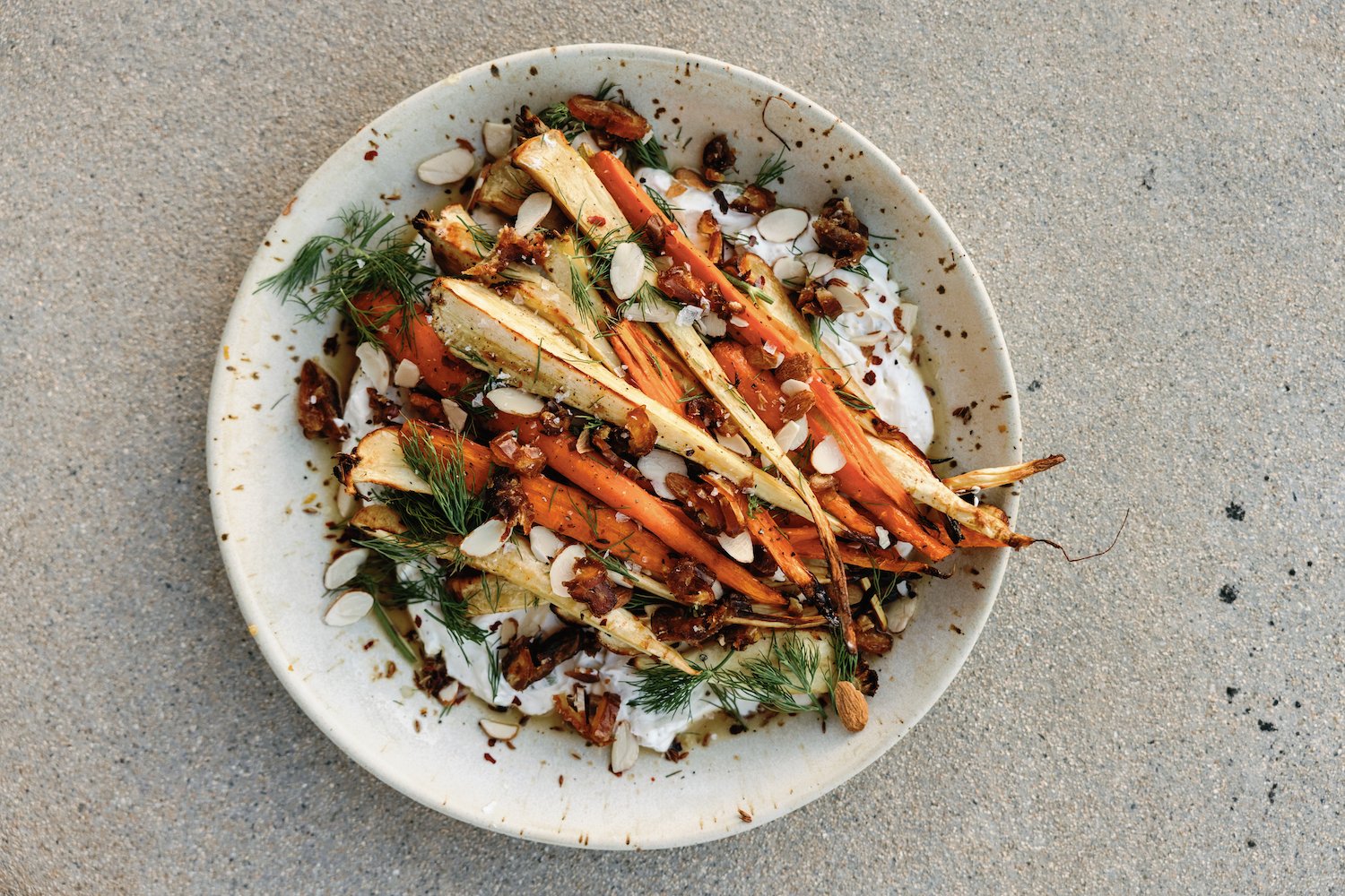 charred carrots with honey-lime yogurt, dates, and almonds