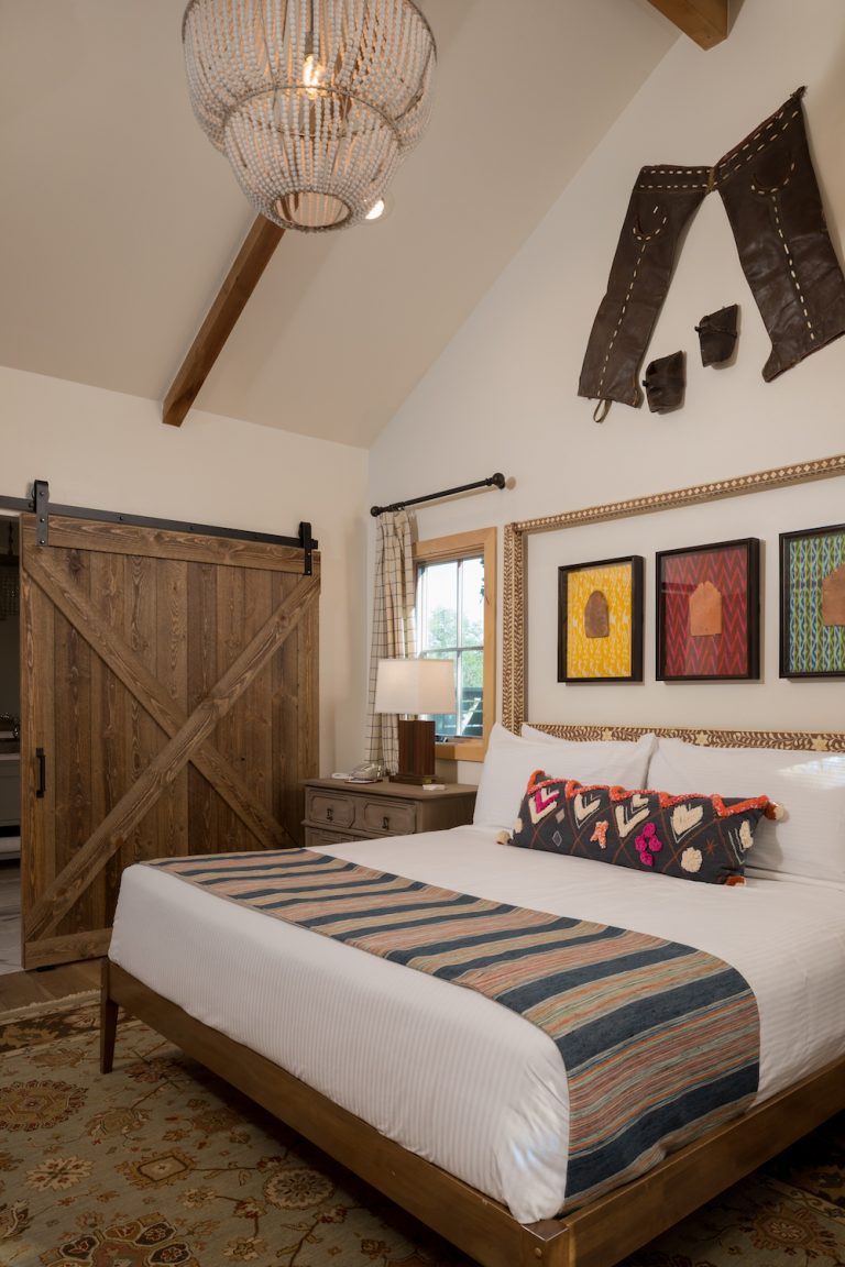 Rustic cabin bedroom at Camp Lucy in Dripping Springs, Texas.