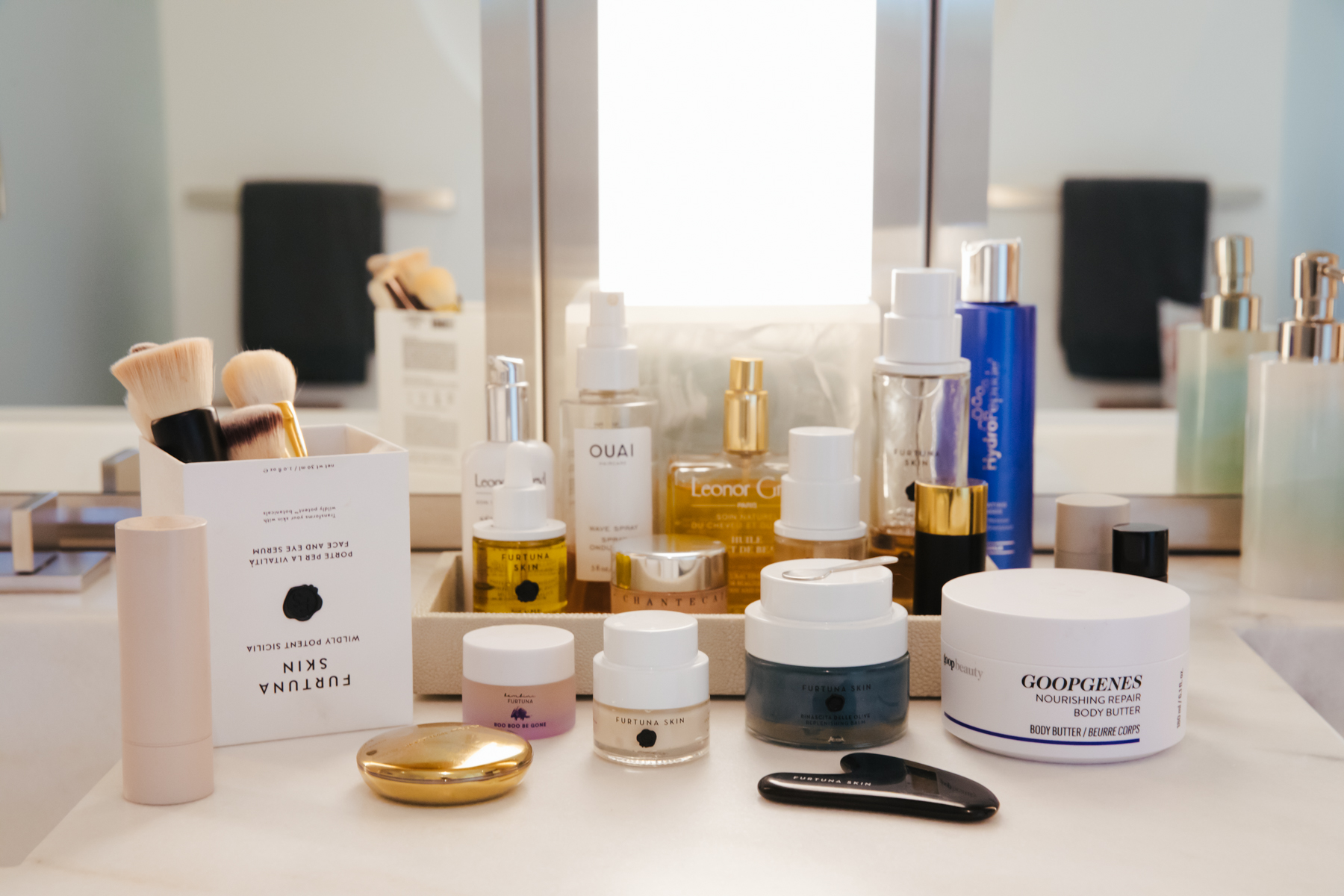 Skincare brands like furtuna and goop on a bathroom counter - andrea posadas photography
