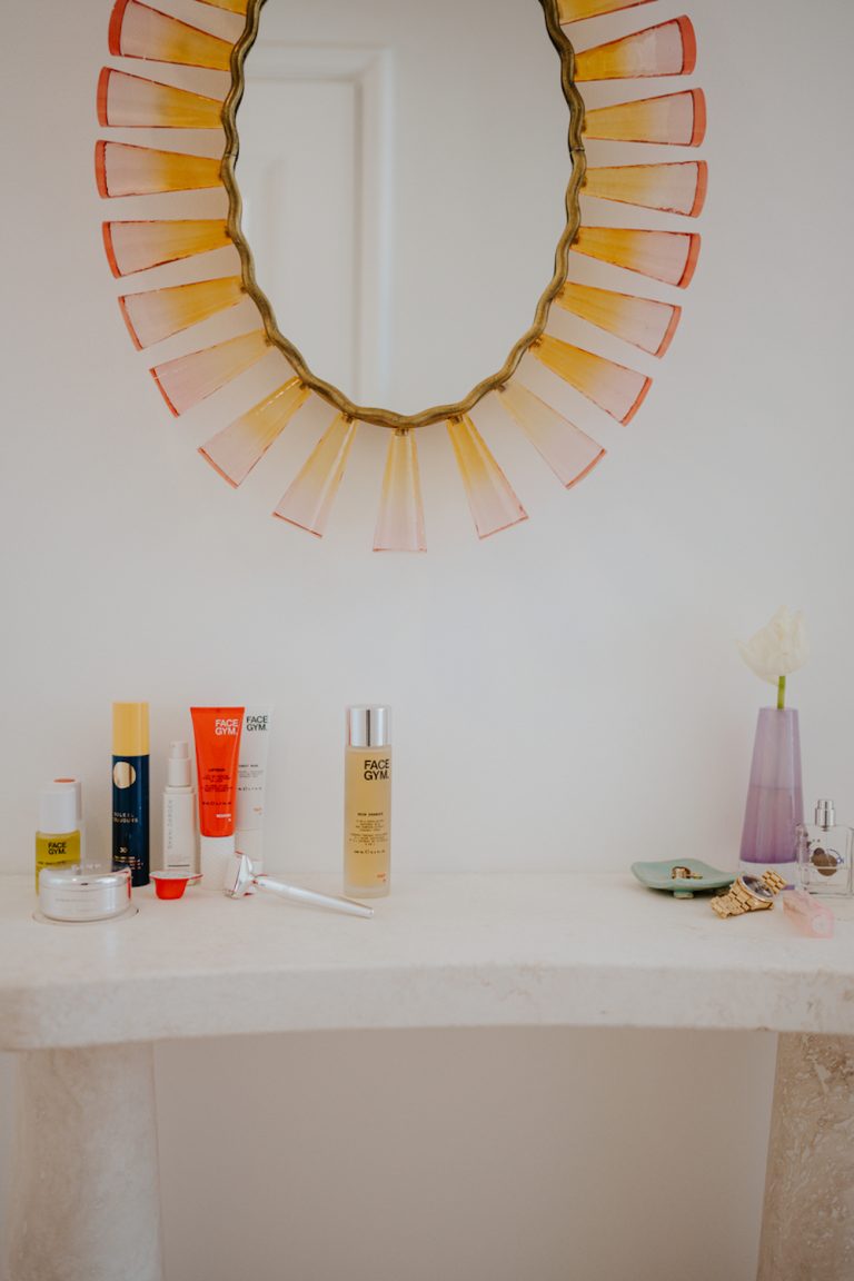 Beauty products on bathroom counter.