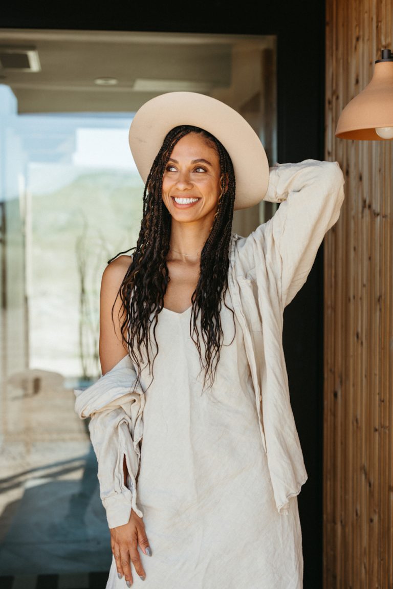 Brandy Joy Smith smiling wearing sun hat.