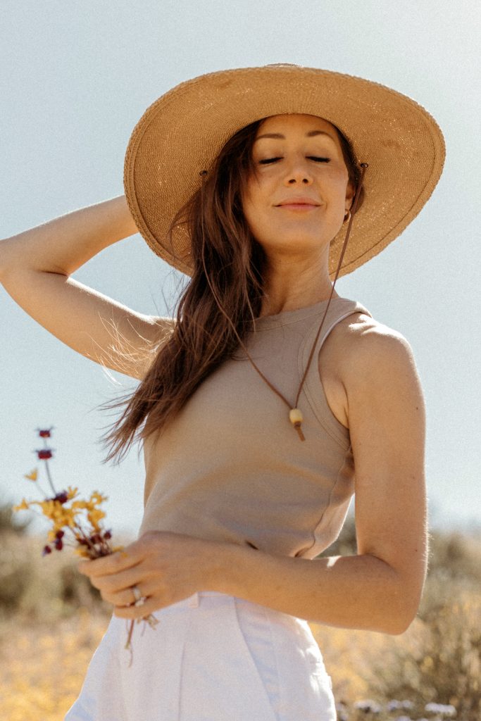 Camille Styles wearing sunhat in Joshua Tree.