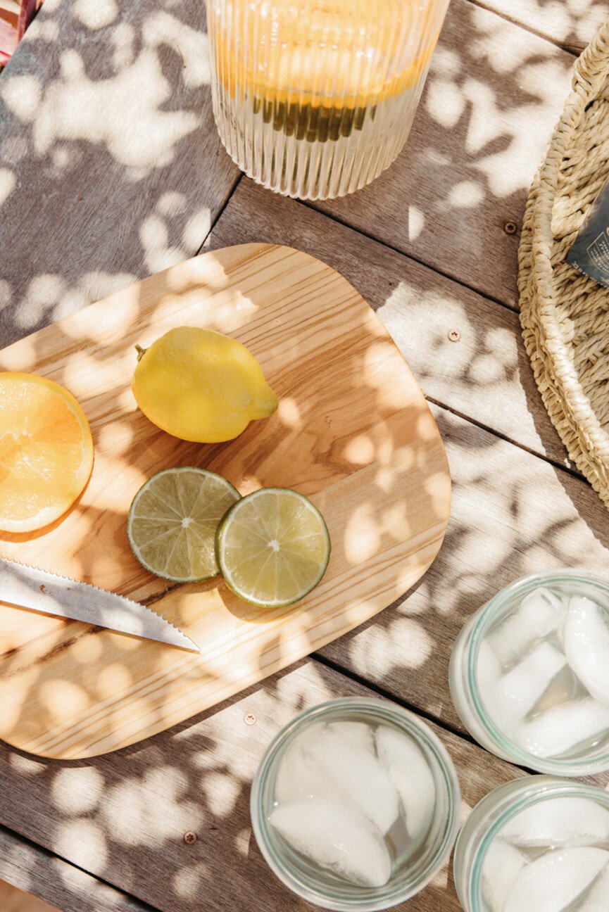 Slices of citrus fruit on a cutting board.