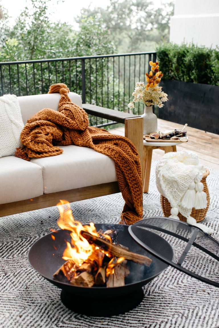 Cozy outdoor fire pit on deck.