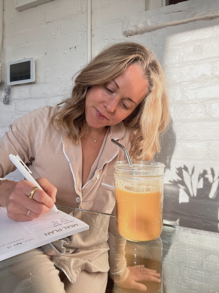 Nutritionist Edie Horstman meal planning while drinking iced coffee.