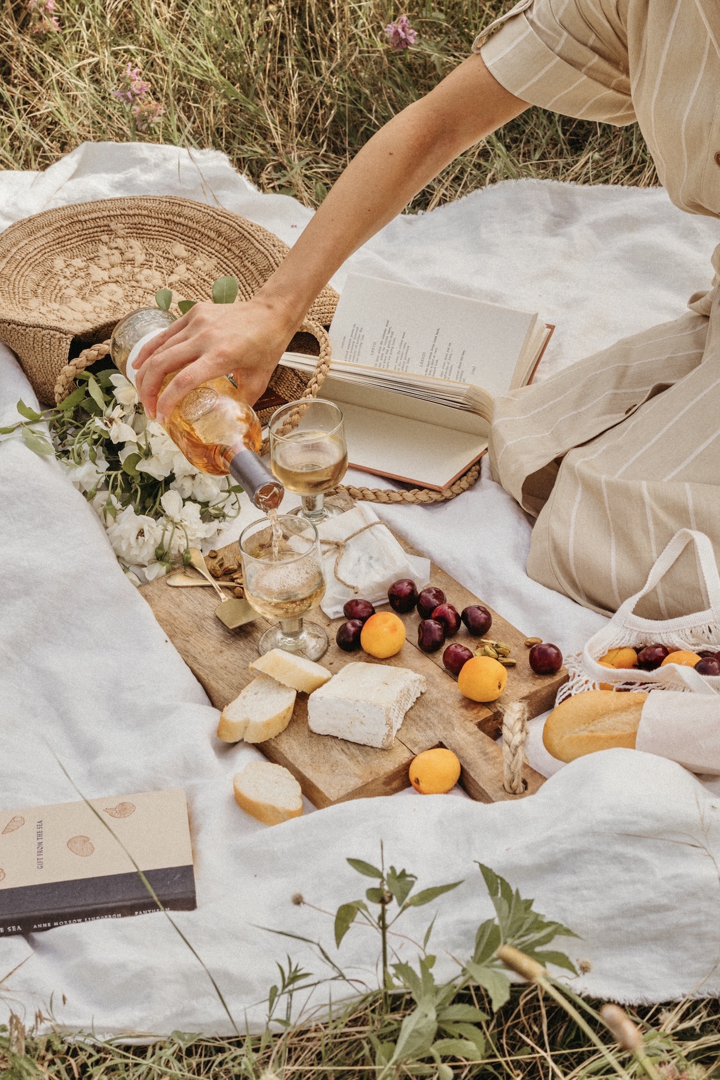 picnic aesthetic spread out on white linen