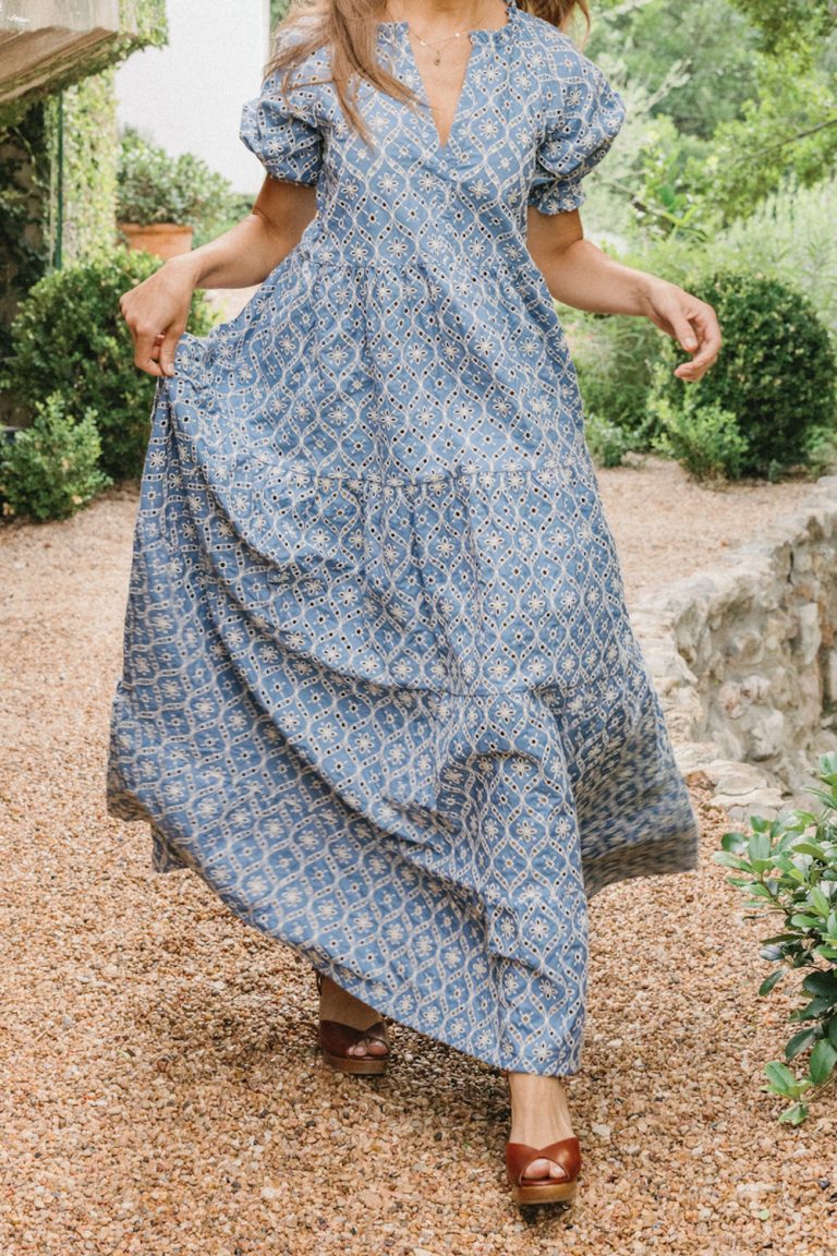 Woman wearing long printed dress.