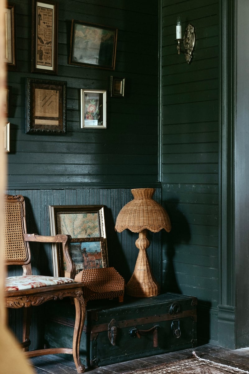 vintage farmhouse with deep green walls and rattan - michelle