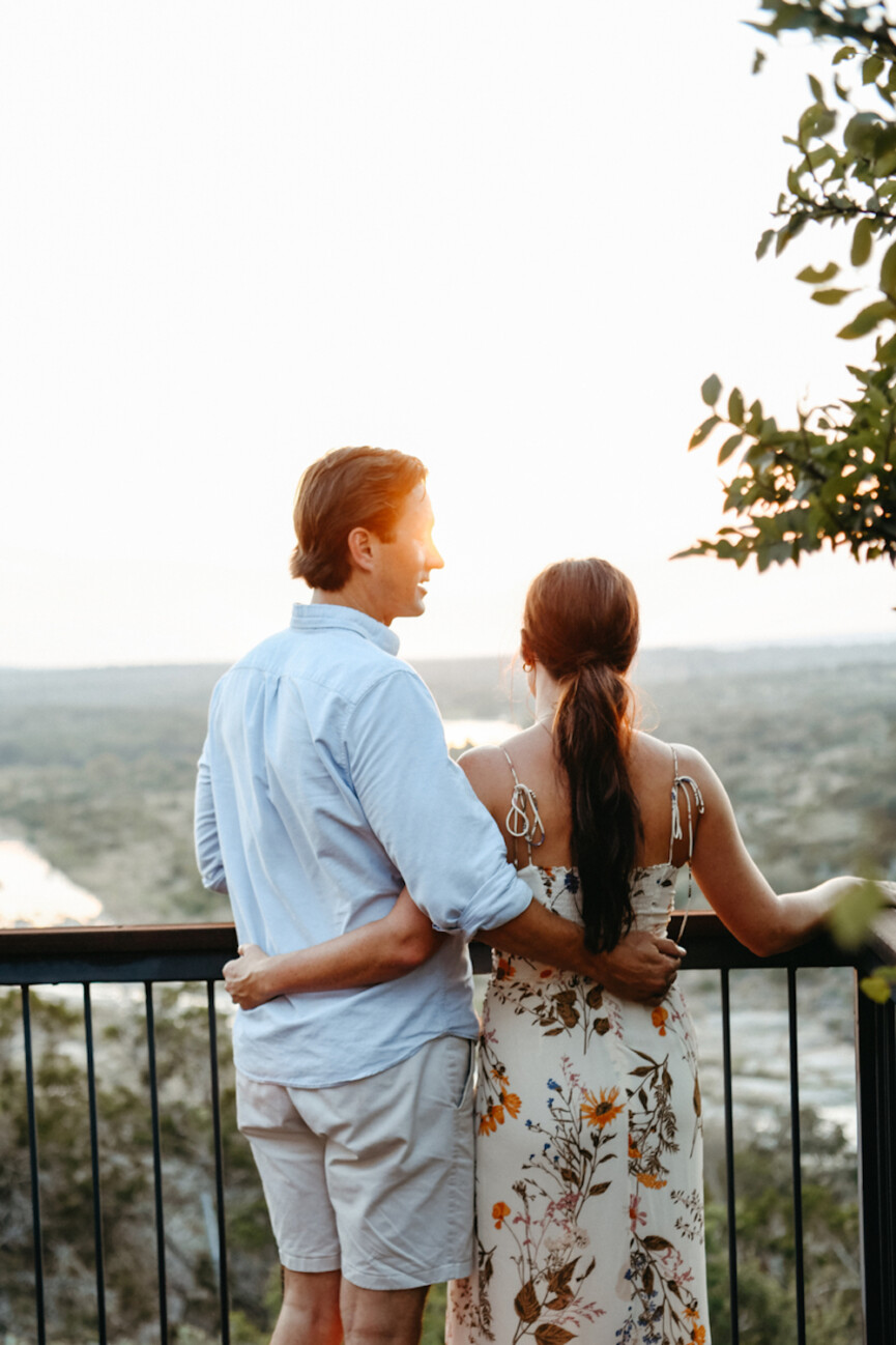 couple looking over balcony