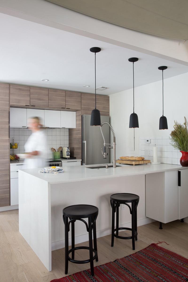 12 Waterfall Kitchen Island Ideas For A Streamlined Modern Look   A White Waterfall Kitchen Island In A Modern Home.  